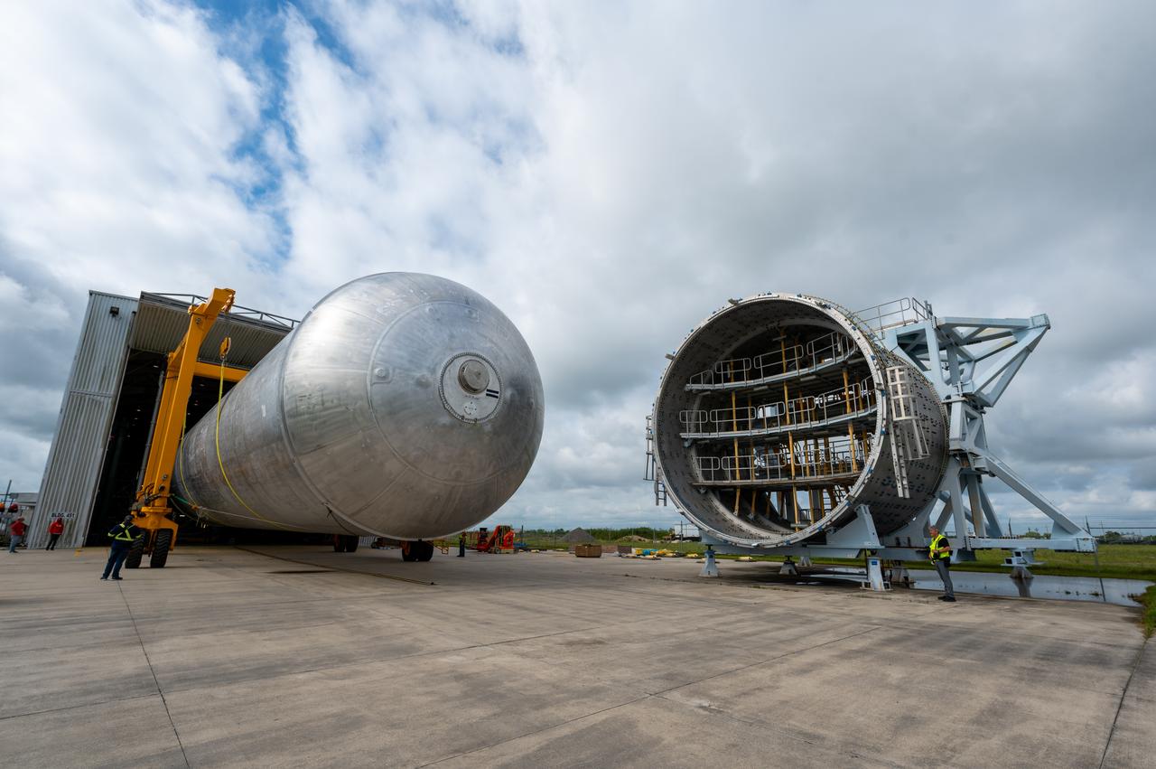 The core stage liquid hydrogen tank for the Artemis III mission completed proof testing, and technicians returned it to the main factory building at NASA’s Michoud Assembly Facility in New Orleans where it will undergo more outfitting. As part of proof testing, technicians apply a simple soap solution and check for leaks by observing any bubble formation on the welds. The technician removed the bubble solution with distilled water and then dried the area of application to prevent corrosion. To build the Space Launch System (SLS) rocket’s 130-foot core stage liquid hydrogen tank, engineers use robotic tools to weld five-barrel segments. This process results in a tank with around 1,900 feet, or more than six football fields, of welds that must be tested by hand. After the leak tests, the core stage lead, Boeing, pressurized the SLS tank to further ensure there were no leaks. After it passed proof testing, technicians moved the Artemis III liquid hydrogen tank to Michoud’s main factory. Soon, the technicians will prime and apply a foam-based thermal protection system that protects the tank during launch. Later, the tank will be joined with other parts of the core stage to form the entire 212-foot rocket stage with its four RS-25 engines that produce 2 million pounds of thrust to help launch the rocket. Artemis III will land the first astronauts on the lunar surface.